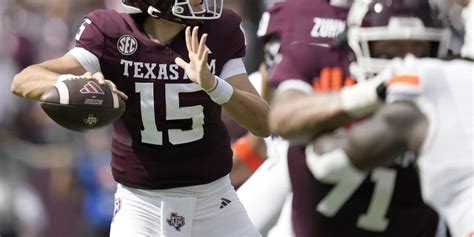 Johnson throws 2 TD passes after Weigman injured to lead Texas A&M to 27-10 win over Auburn